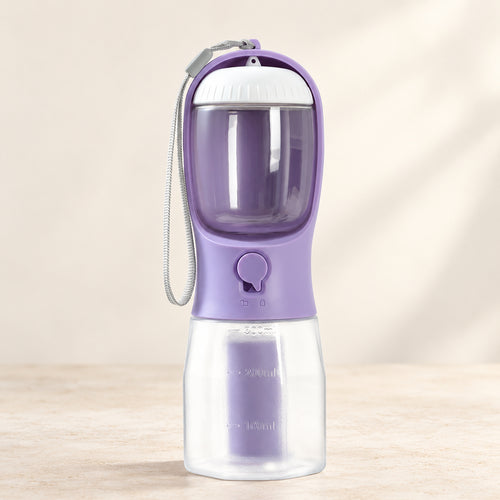 Wisteria Purple 300 ml dog travel water bottle on a light stone surface; AI-edited studio setting